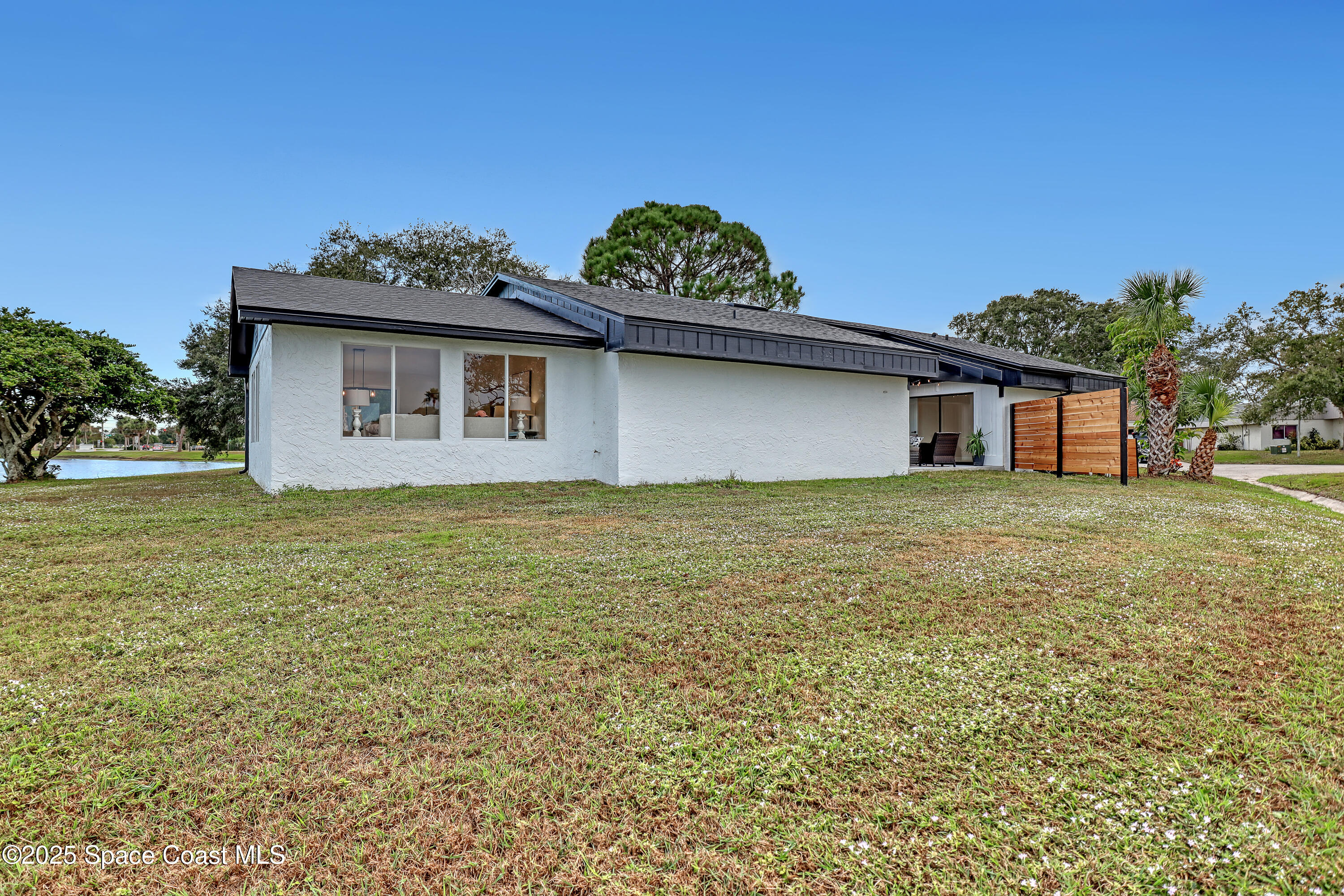 443 Myrtlewood Road Melbourne, FL 32940 - Photo 65 of 72 a house that has a lot of plants in it