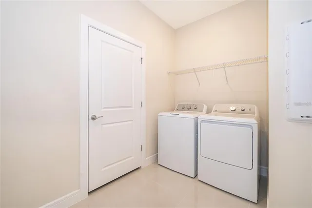 a utility room with dryer and washer