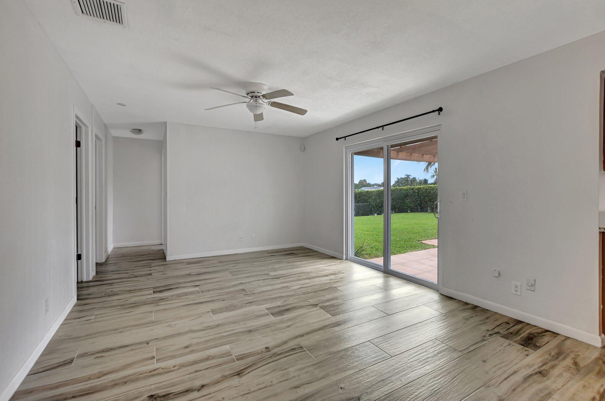 254 Northwest 11th Avenue Boca Raton, FL 33486 - Photo 25 of 66 a view of an empty room with glass door