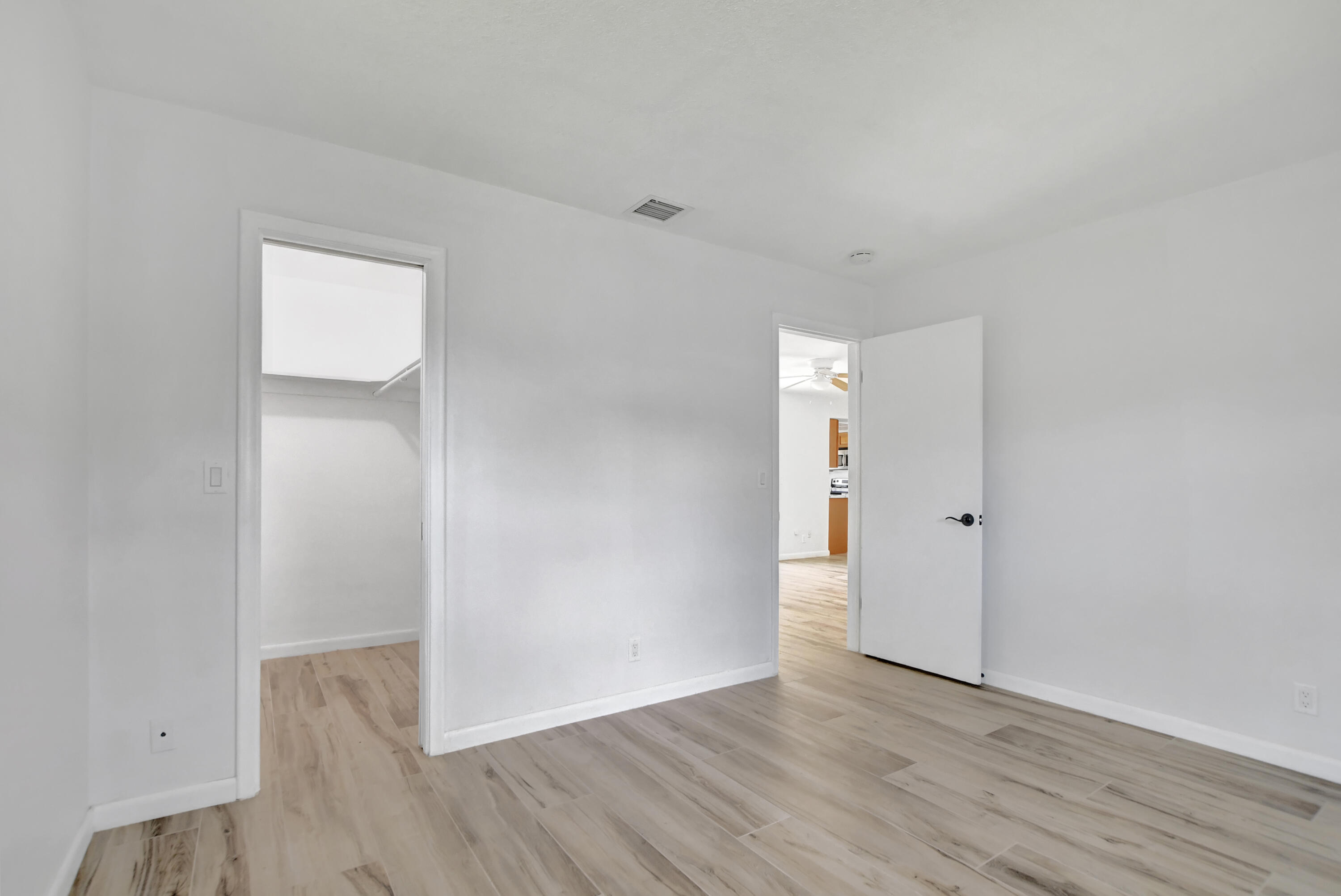 254 Northwest 11th Avenue Boca Raton, FL 33486 - Photo 36 of 66 a view of an empty room with wooden floor