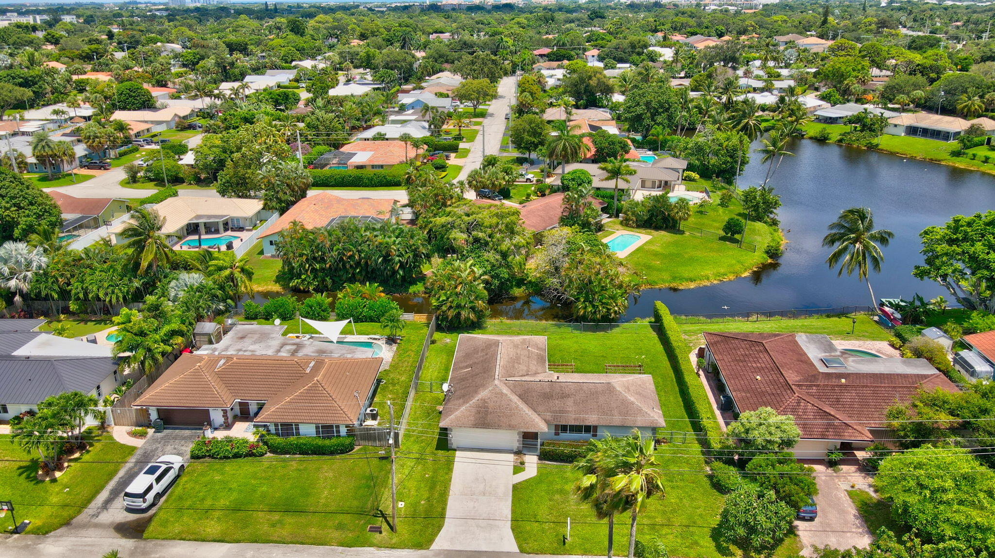 254 Northwest 11th Avenue Boca Raton, FL 33486 - Photo 65 of 66 an aerial view of residential houses with outdoor space and swimming pool