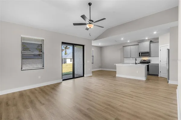 a view of a kitchen with a sink and a window