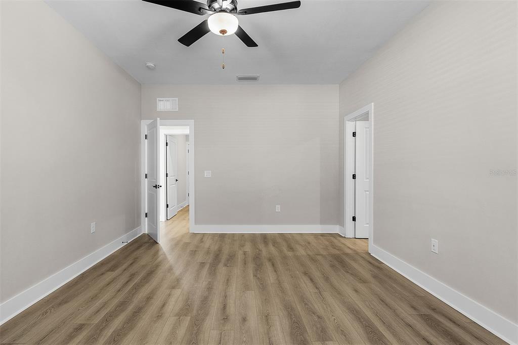 13515 Walden Sheffield Road Dover, FL 33527 - Photo 5 of 7 wooden floor in an empty room