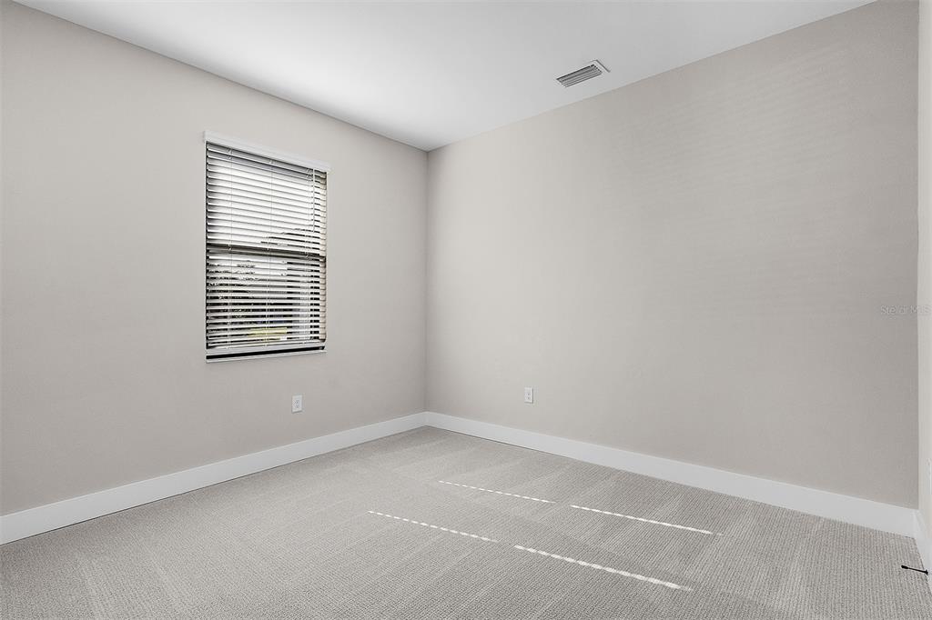 13515 Walden Sheffield Road Dover, FL 33527 - Photo 7 of 7 a view of an empty room with a window
