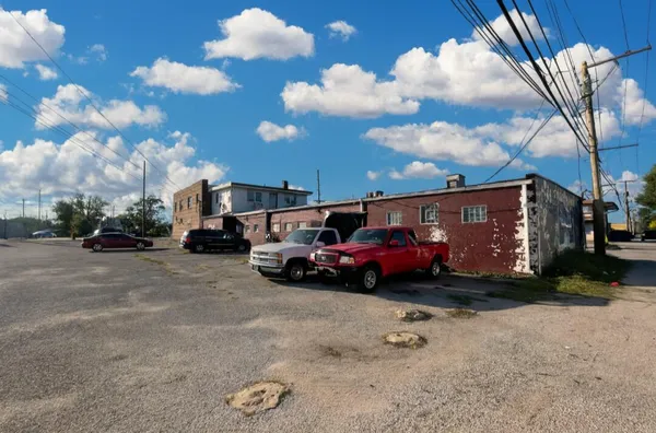 a view of street with parked cars