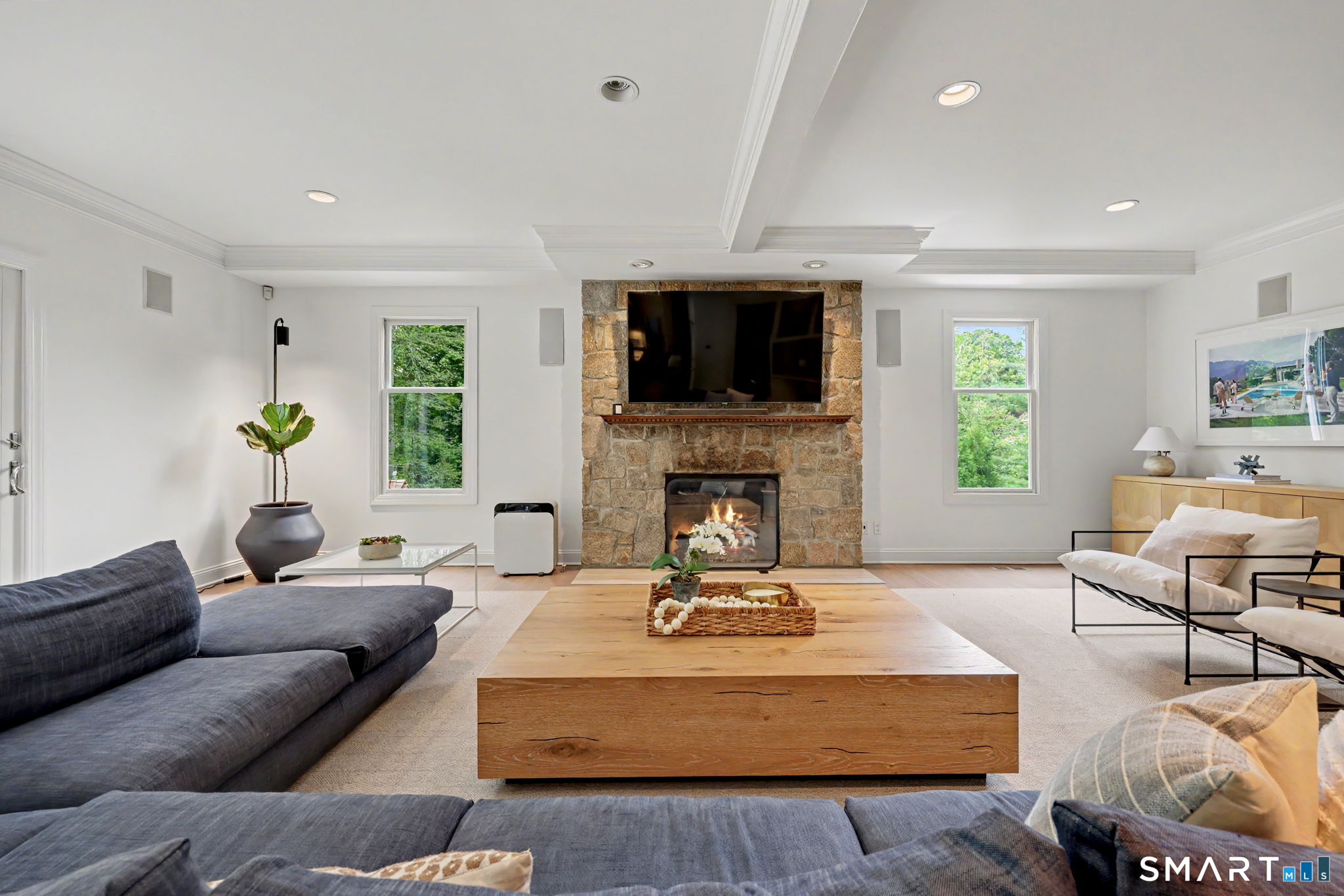 10 Side Hill Road Westport, CT 06880 - Photo 12 of 40 a living room with furniture a flat screen tv and a fireplace