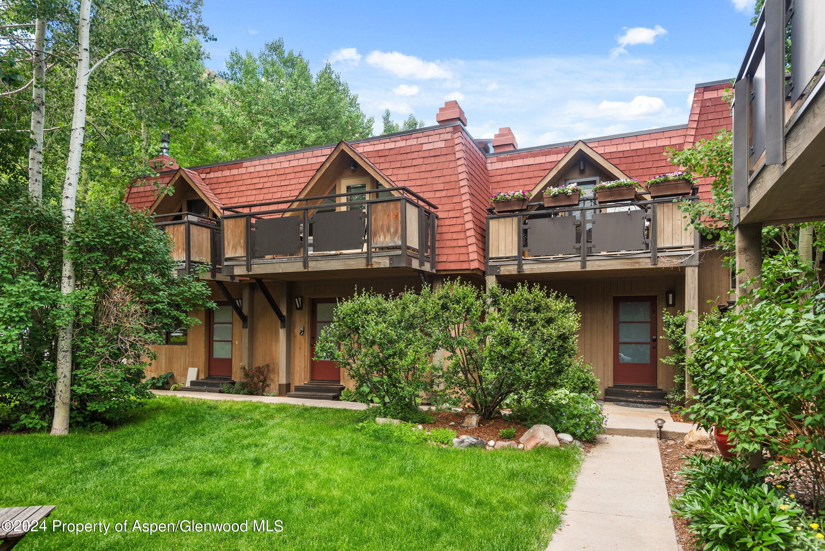 108 West Hyman Avenue, Unit 2 Aspen, CO 81611 - Photo 2 of 18 front view of a house with a yard