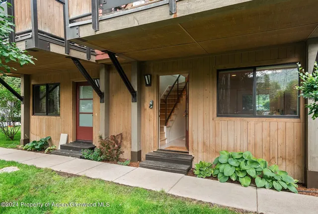 a front view of a house with a garage
