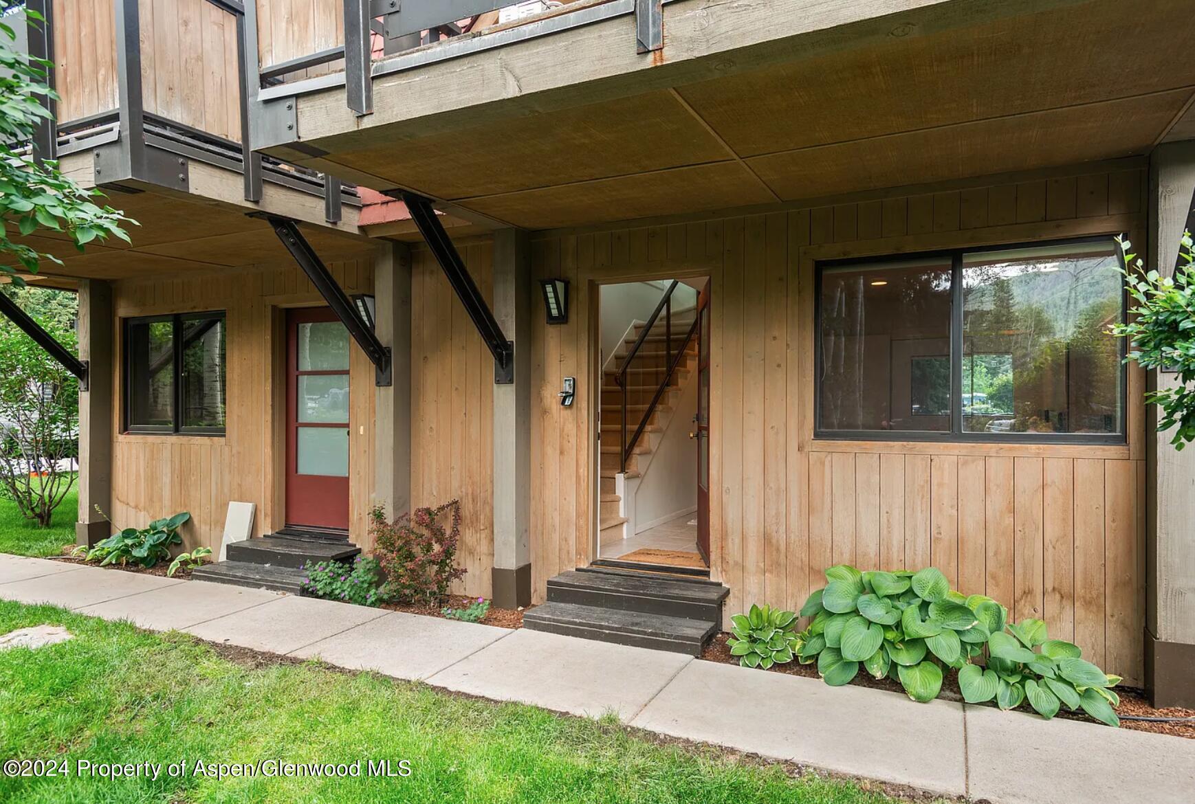 108 West Hyman Avenue, Unit 2 Aspen, CO 81611 - Photo 3 of 18 a front view of a house with a garage
