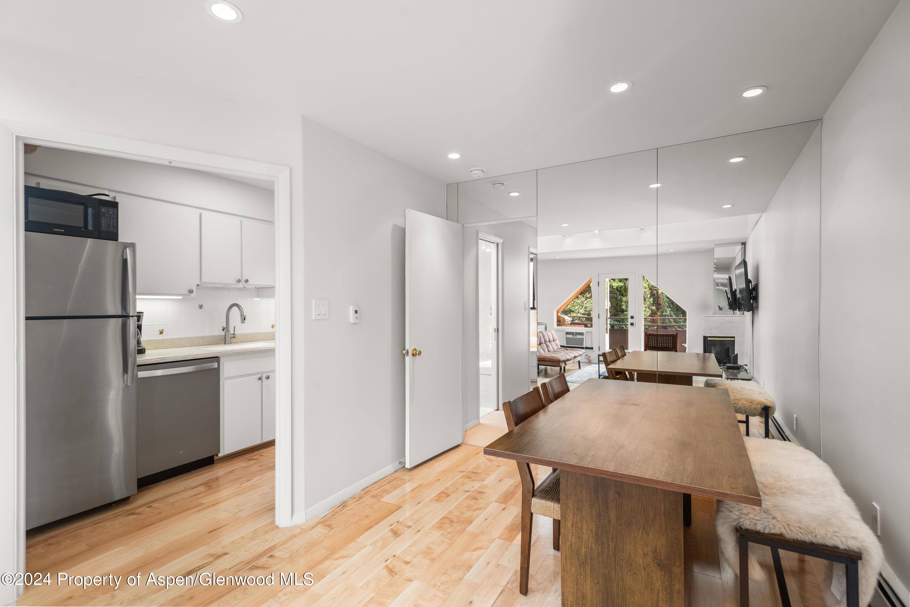 108 West Hyman Avenue, Unit 2 Aspen, CO 81611 - Photo 7 of 18 a kitchen with refrigerator and cabinets