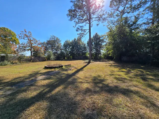 a view of swimming pool with an outdoor space and seating area