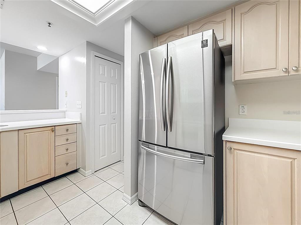 399 150th Avenue, Unit 218 Madeira Beach, FL 33708 - Photo 16 of 84 a metallic refrigerator freezer sitting in a kitchen
