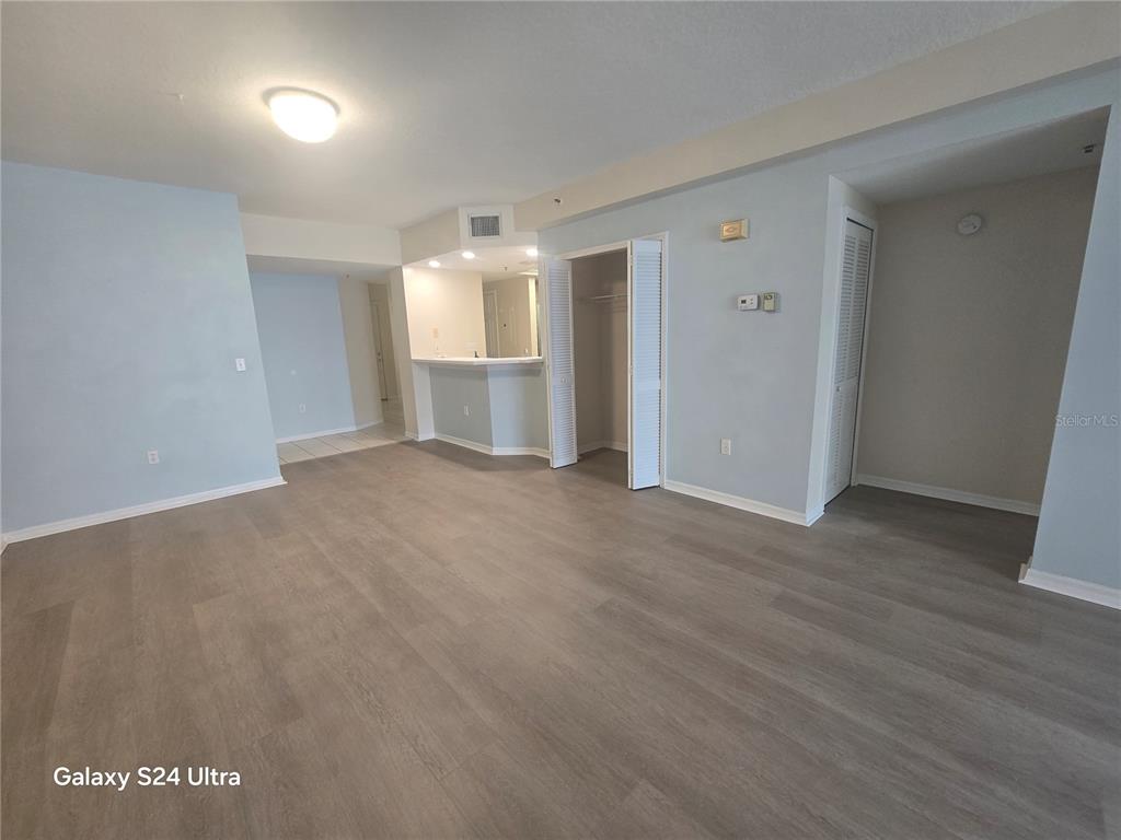 399 150th Avenue, Unit 218 Madeira Beach, FL 33708 - Photo 31 of 84 a view of empty room with wooden floor