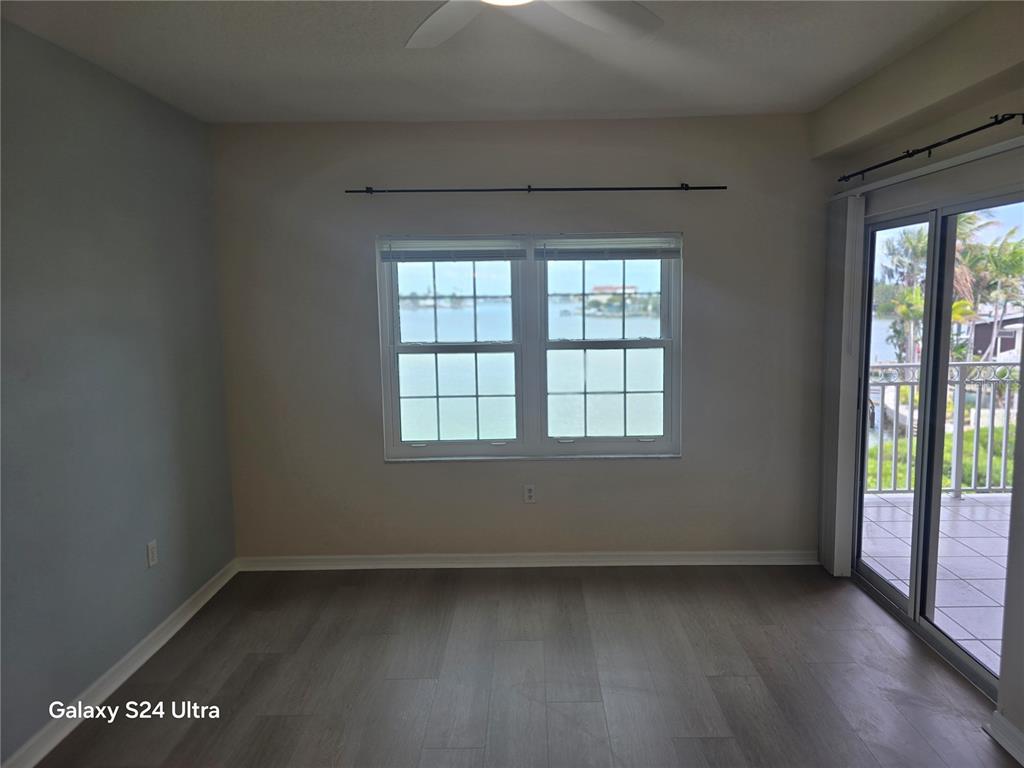 399 150th Avenue, Unit 218 Madeira Beach, FL 33708 - Photo 39 of 84 an empty room with a window
