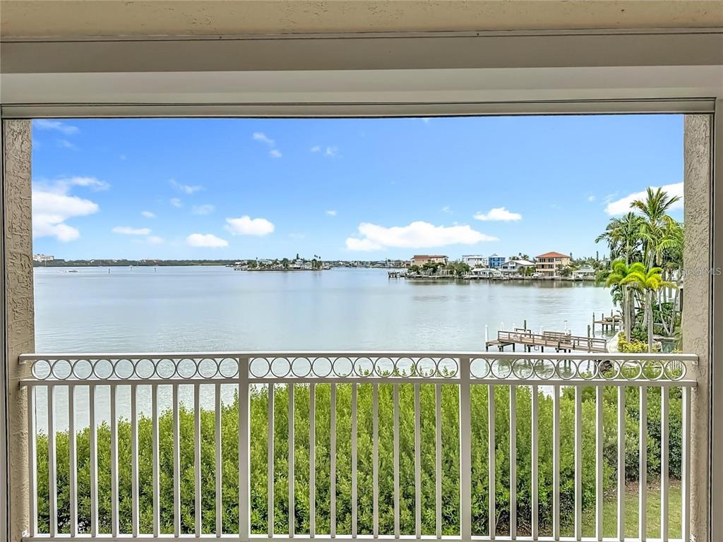 399 150th Avenue, Unit 218 Madeira Beach, FL 33708 - Photo 4 of 84 a view of a balcony with lake