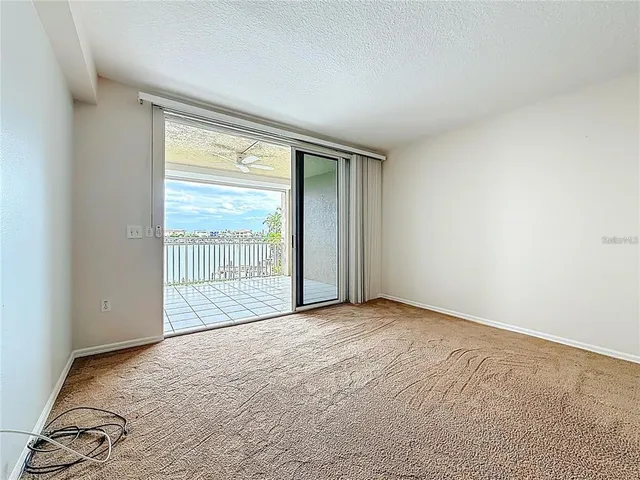 an aerial view of a house with a lake view