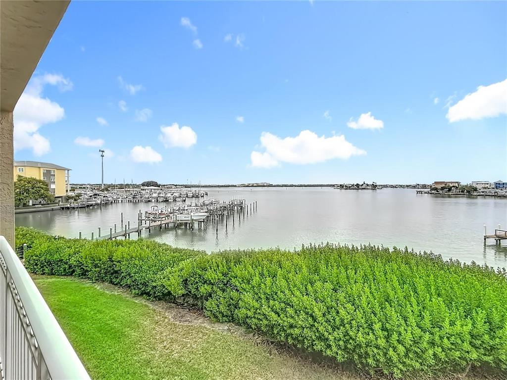 399 150th Avenue, Unit 218 Madeira Beach, FL 33708 - Photo 65 of 84 a view of a lake with a big yard