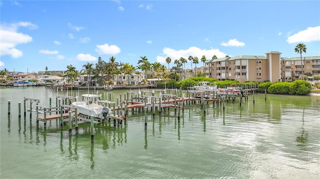 399 150th Avenue, Unit 218 Madeira Beach, FL 33708 - Photo 73 of 84 a view of a lake with building in front of it