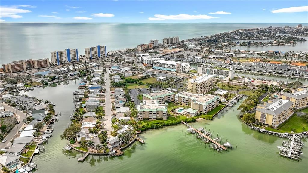 399 150th Avenue, Unit 218 Madeira Beach, FL 33708 - Photo 81 of 84 an aerial view of residential houses with outdoor space