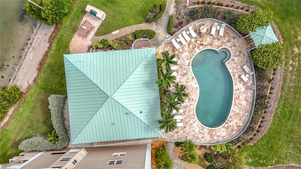 399 150th Avenue, Unit 218 Madeira Beach, FL 33708 - Photo 83 of 84 an aerial view of a house with a swimming pool