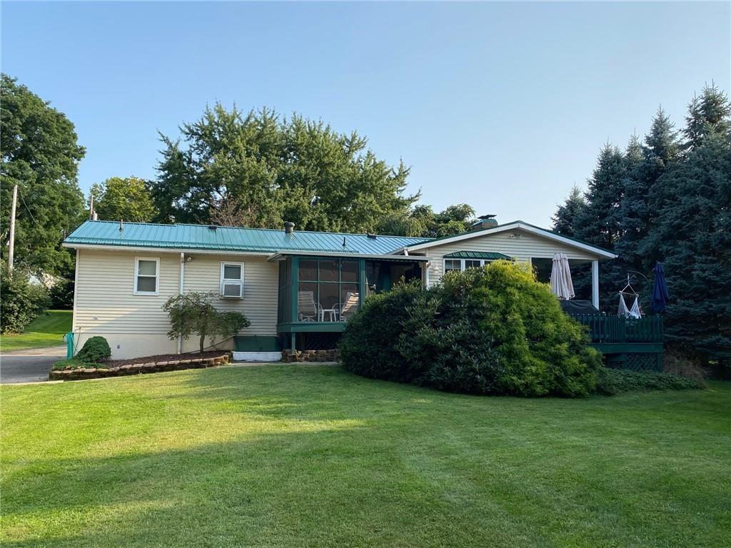 6870 Old Ridge Road Fairview, PA 16415 - Photo 7 of 25 a view of a house with backyard and garden