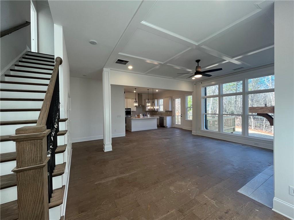 3745 Reserve Overlook Way Cumming, GA 30041 - Photo 11 of 87 a view of empty room with wooden floor and windows