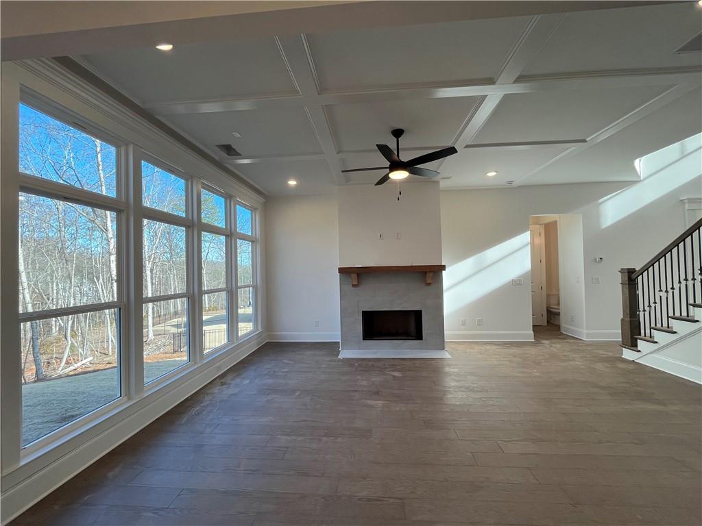 3745 Reserve Overlook Way Cumming, GA 30041 - Photo 2 of 87 a view of an empty room with a fireplace and a window