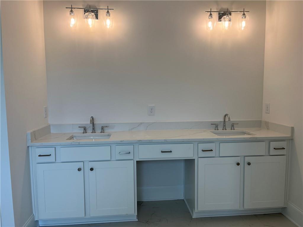 3745 Reserve Overlook Way Cumming, GA 30041 - Photo 35 of 87 a bathroom with a sink and cabinets