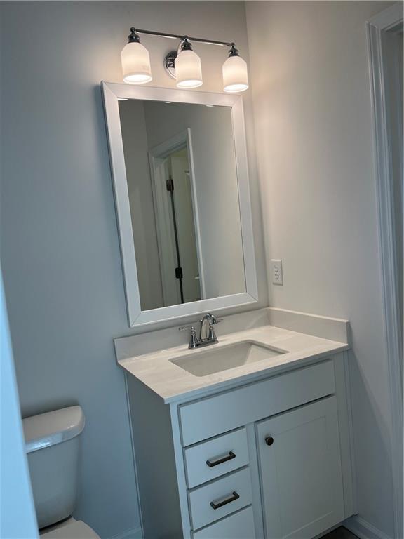 3745 Reserve Overlook Way Cumming, GA 30041 - Photo 42 of 87 a bathroom with a sink toilet and mirror