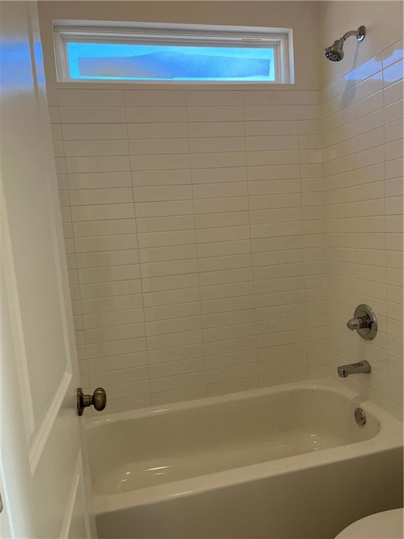 3745 Reserve Overlook Way Cumming, GA 30041 - Photo 49 of 87 a bathroom with a bathtub and a shower