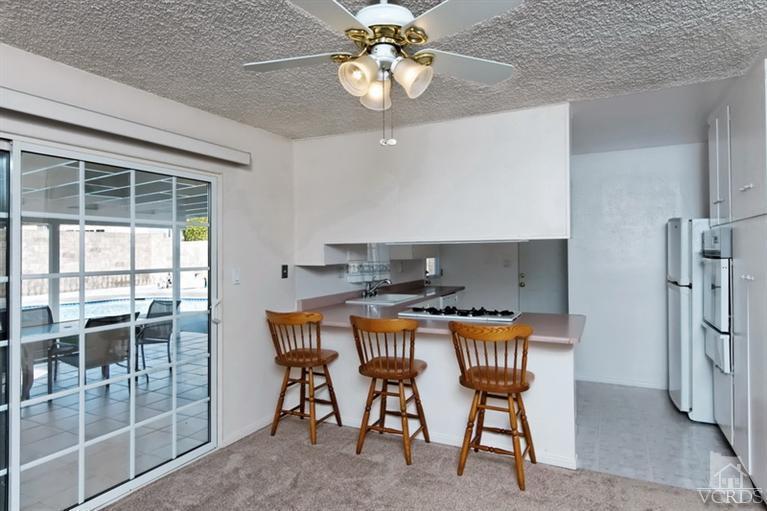 4553 Alpine Street Simi Valley, CA 93063 - Photo 11 of 25 a table and chairs in a kitchen