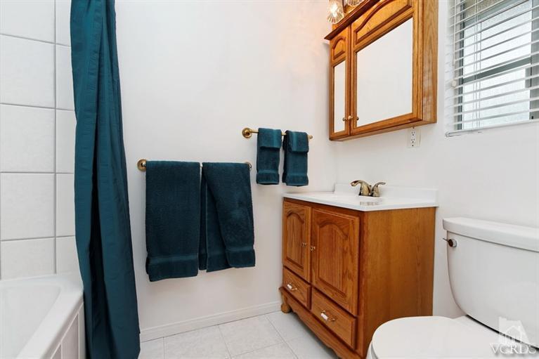 4553 Alpine Street Simi Valley, CA 93063 - Photo 17 of 25 a bathroom with a toilet bathtub and shower