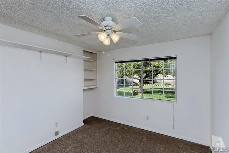 4553 Alpine Street Simi Valley, CA 93063 - Photo 19 of 25 an empty room with windows and fan