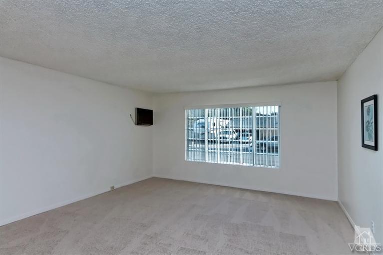 4553 Alpine Street Simi Valley, CA 93063 - Photo 4 of 25 an empty room with a window