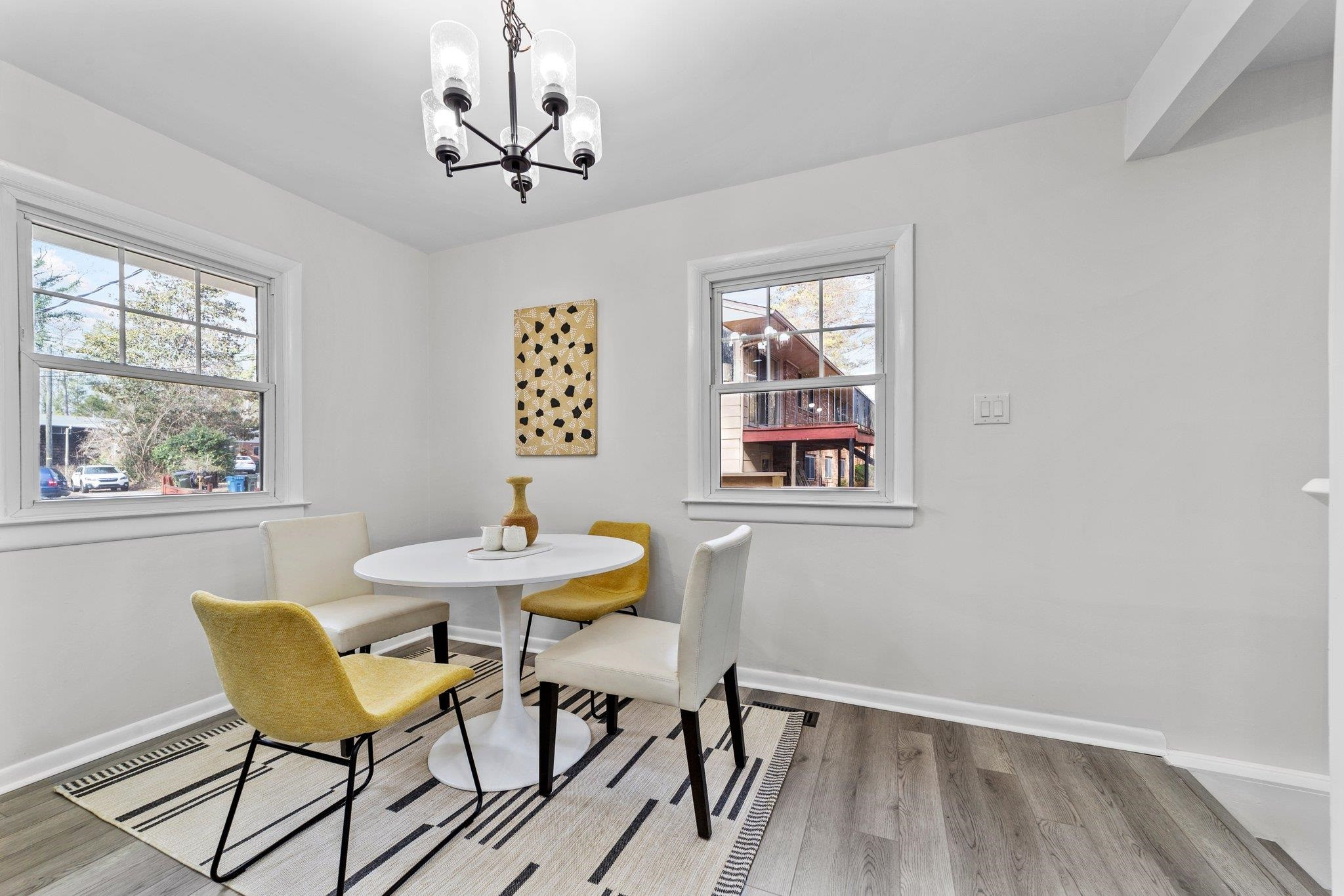 317 Wayne Circle Durham, NC 27707 - Photo 14 of 37 a view of a dining room with furniture window and wooden floor