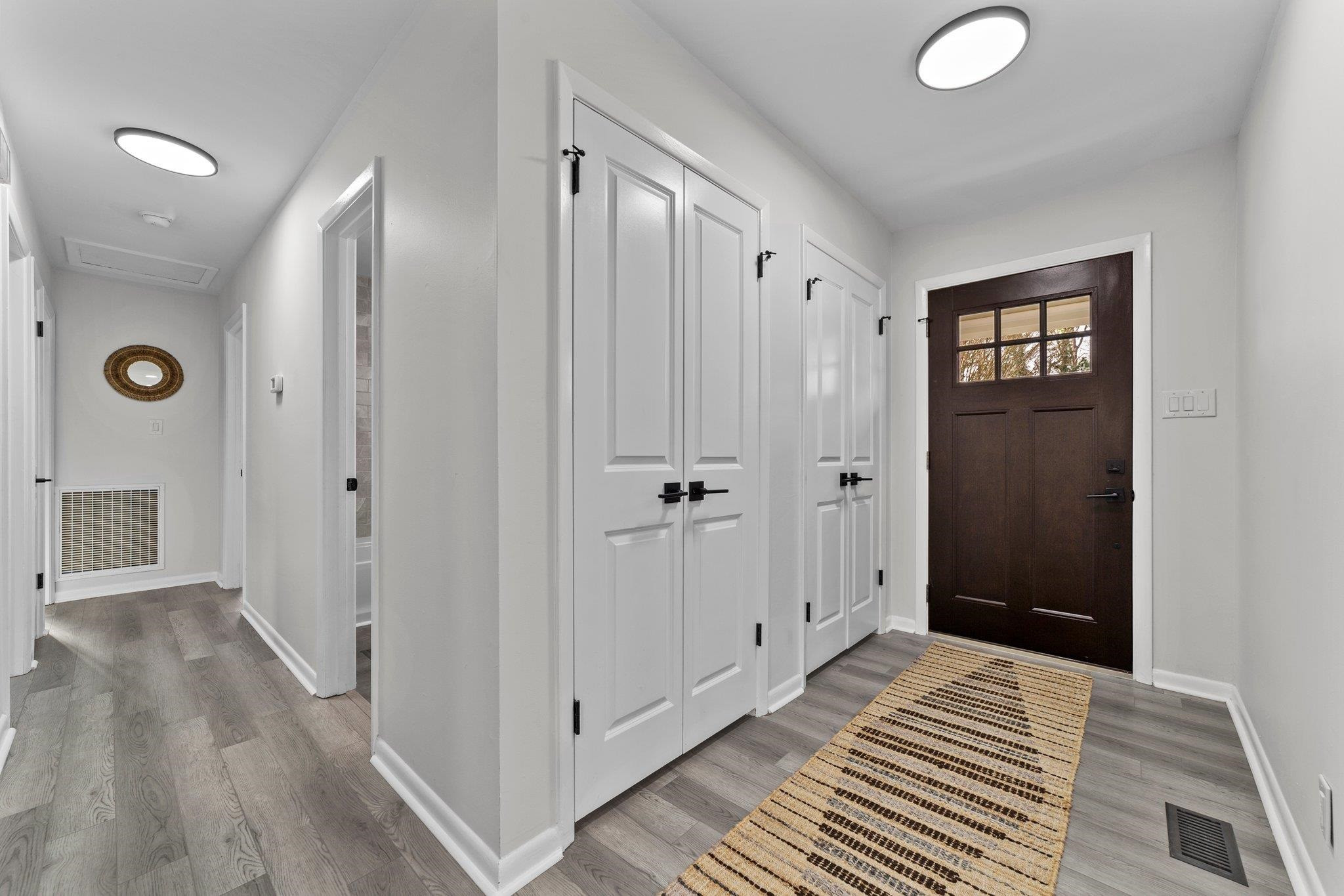 317 Wayne Circle Durham, NC 27707 - Photo 17 of 37 a view of a hallway with wooden floor and closet