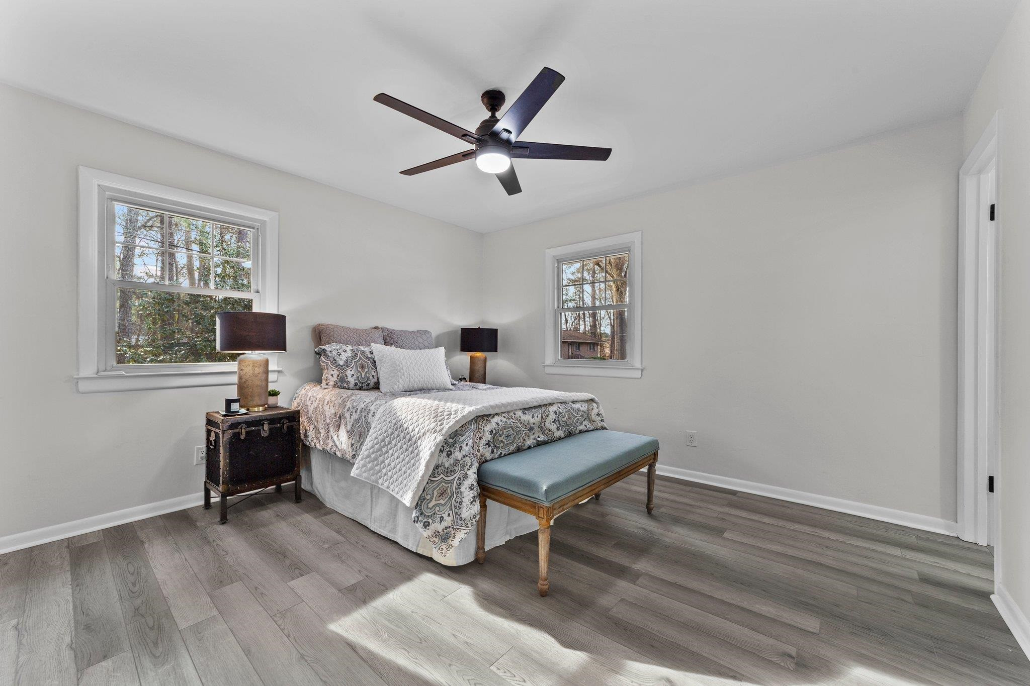 317 Wayne Circle Durham, NC 27707 - Photo 19 of 37 a bedroom with a bed and wooden floor