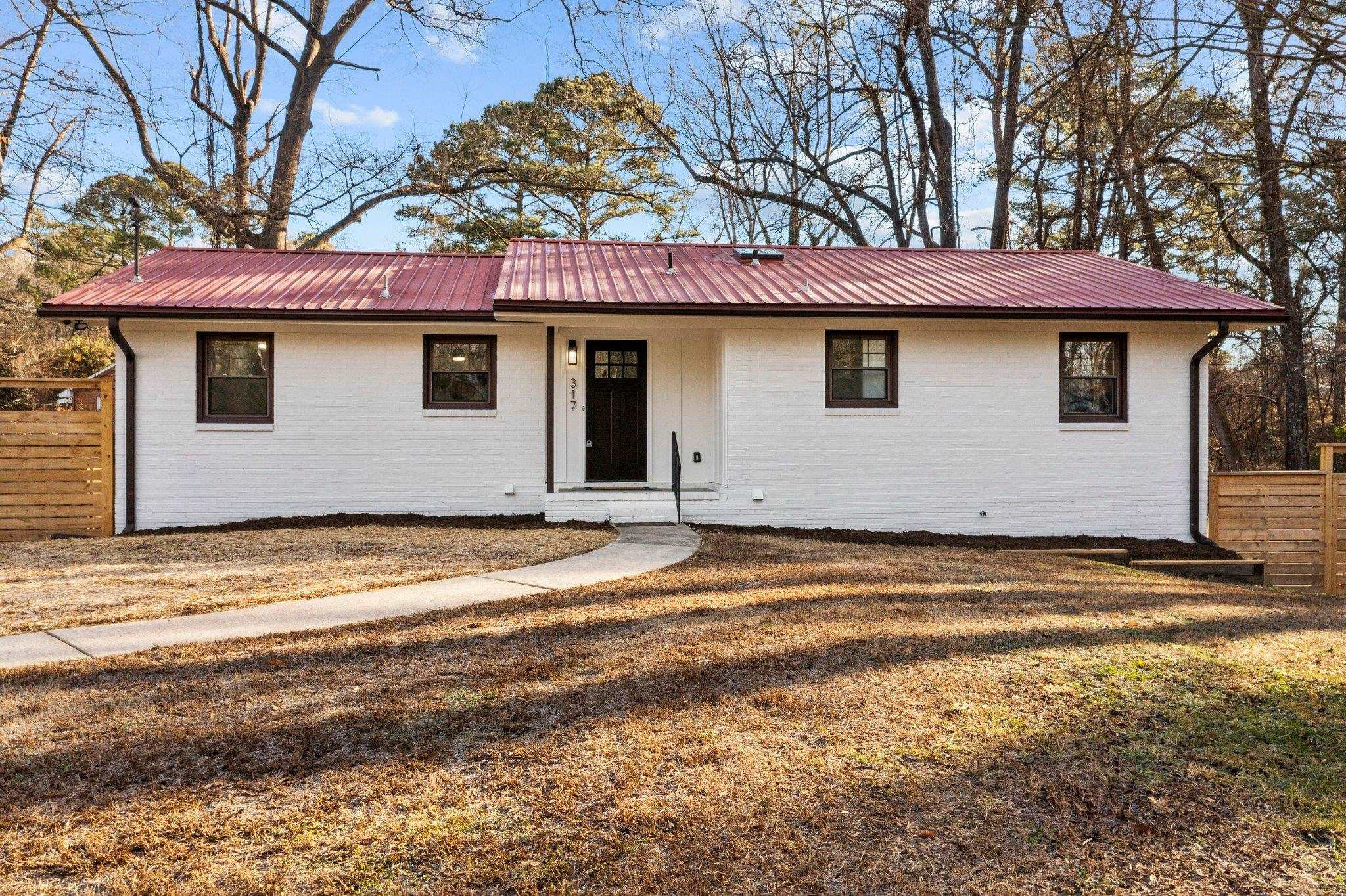 317 Wayne Circle Durham, NC 27707 - Photo 2 of 37 a house that has a tree in front of it