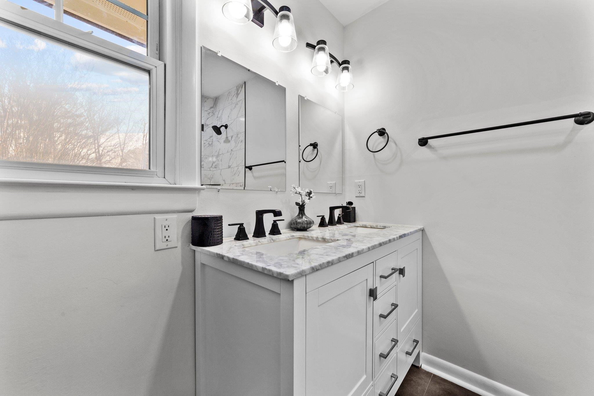 317 Wayne Circle Durham, NC 27707 - Photo 21 of 37 a bathroom with a sink and a mirror