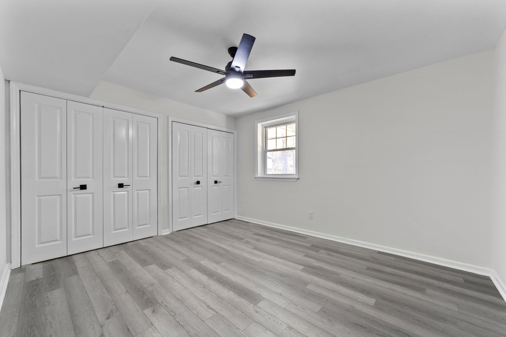 317 Wayne Circle Durham, NC 27707 - Photo 26 of 37 a view of empty room with wooden floor and ceiling fan