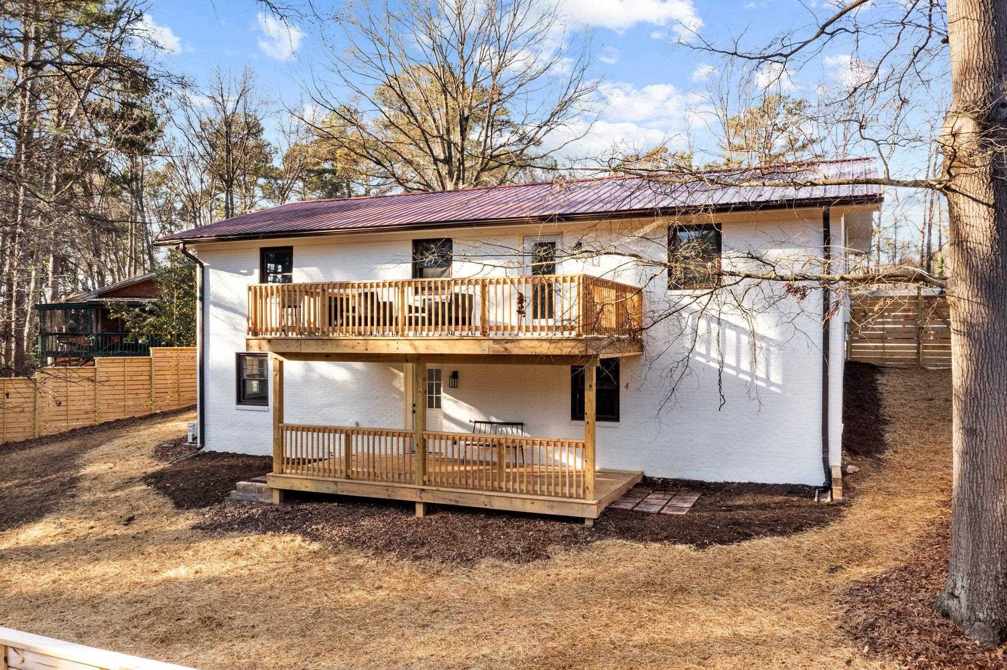 317 Wayne Circle Durham, NC 27707 - Photo 7 of 37 a view of a white house with large trees and outdoor space