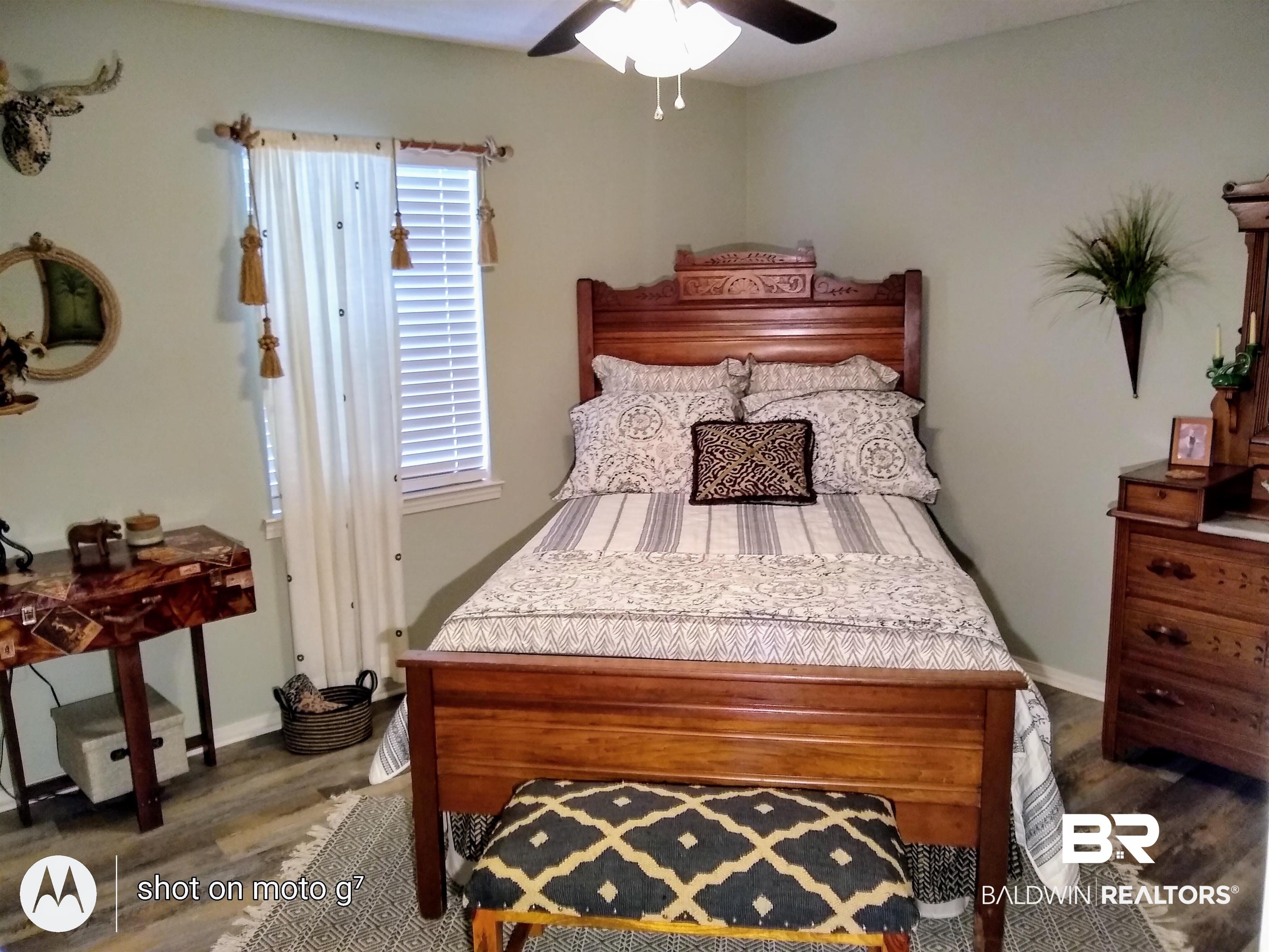 518 Ariel Avenue Foley, AL 36535 - Photo 25 of 47 Bedroom featuring dark wood-type flooring and ceiling fan