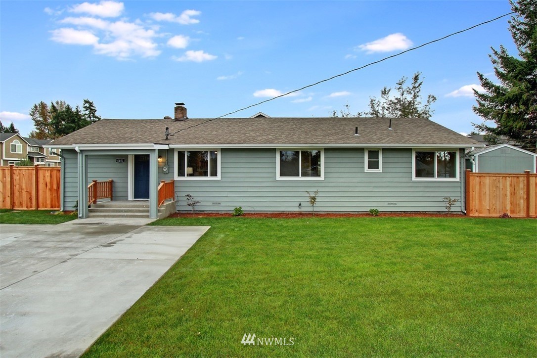 4401 Northeast 10th Street Renton, WA 98059 - Photo 1 of 18 a front view of a house with a yard