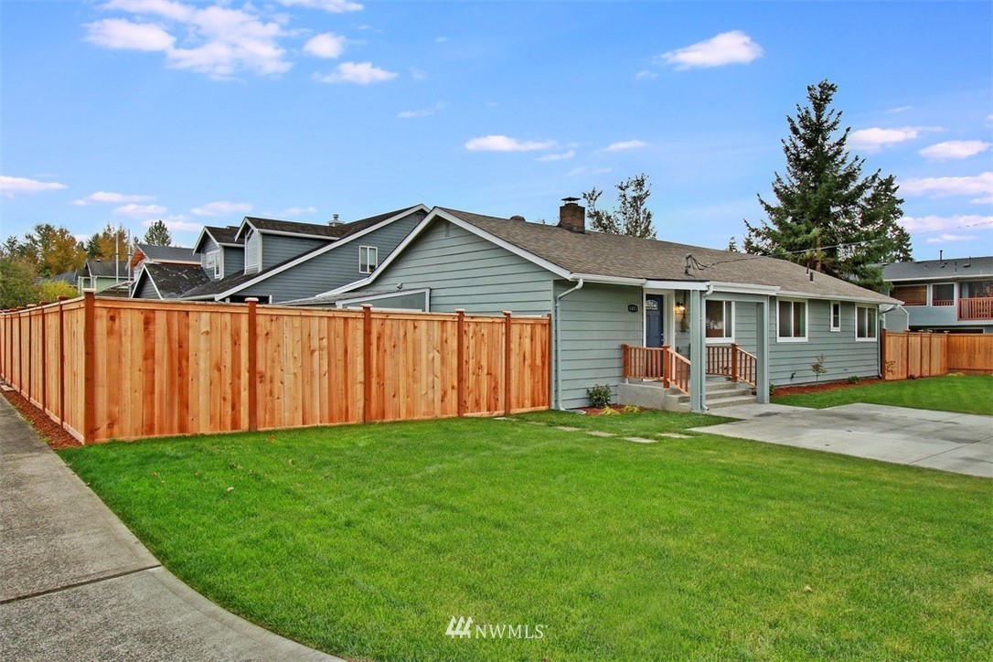 4401 Northeast 10th Street Renton, WA 98059 - Photo 16 of 18 a front view of a house with a yard