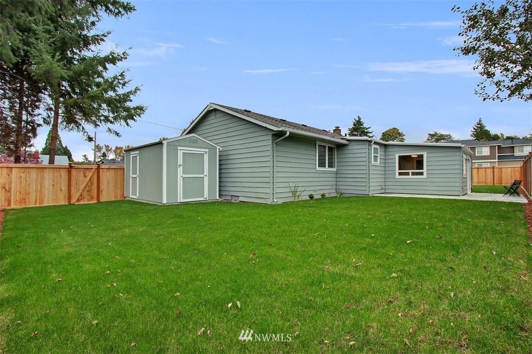4401 Northeast 10th Street Renton, WA 98059 - Photo 17 of 18 a front view of a house with a garden