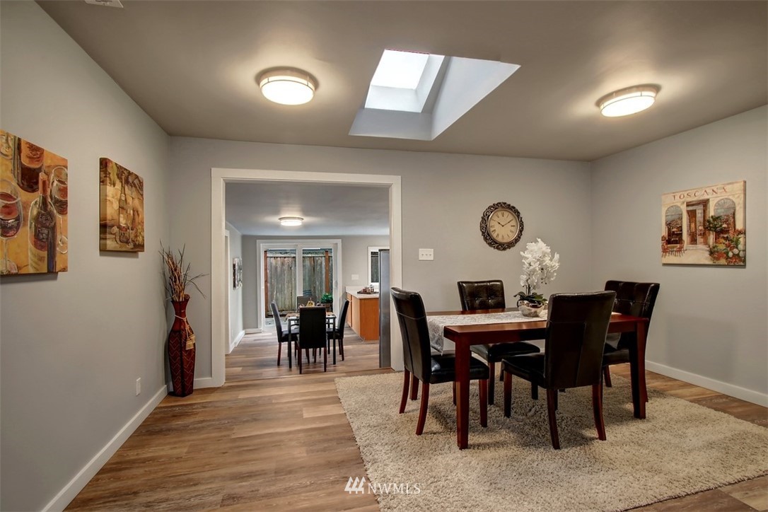 4401 Northeast 10th Street Renton, WA 98059 - Photo 4 of 18 a view of a dining room with furniture and chandelier