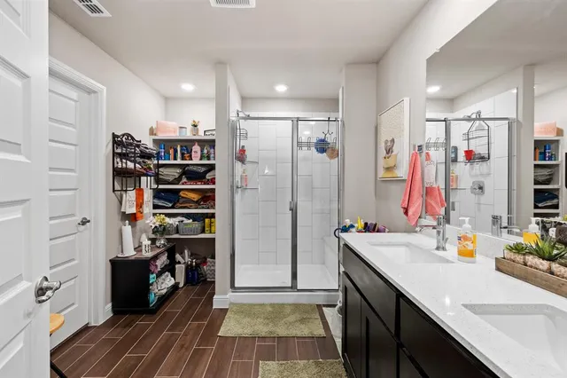 a view of kitchen with stainless steel appliances kitchen island granite countertop a refrigerator and a sink
