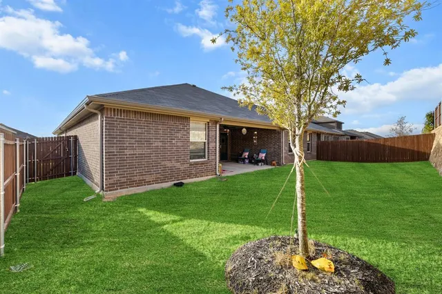 a view of a swimming pool with outdoor seating