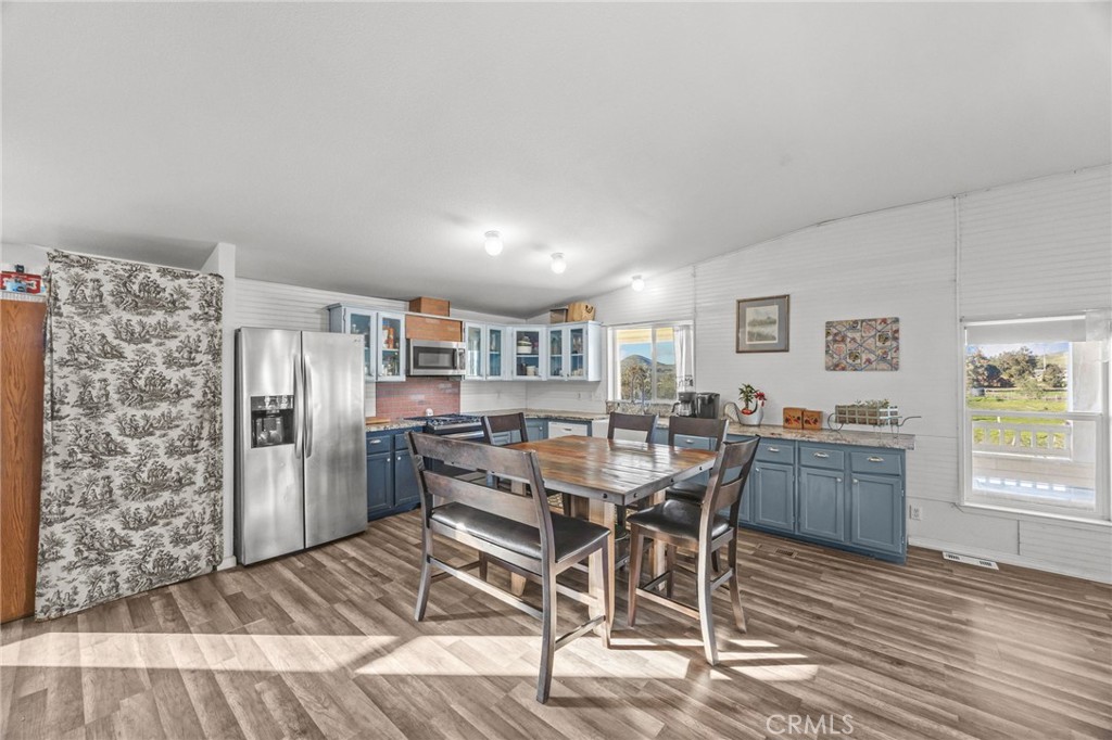 29825 Porth Road Murrieta, CA 92563 - Photo 15 of 40 a view of a kitchen with furniture and wooden floor