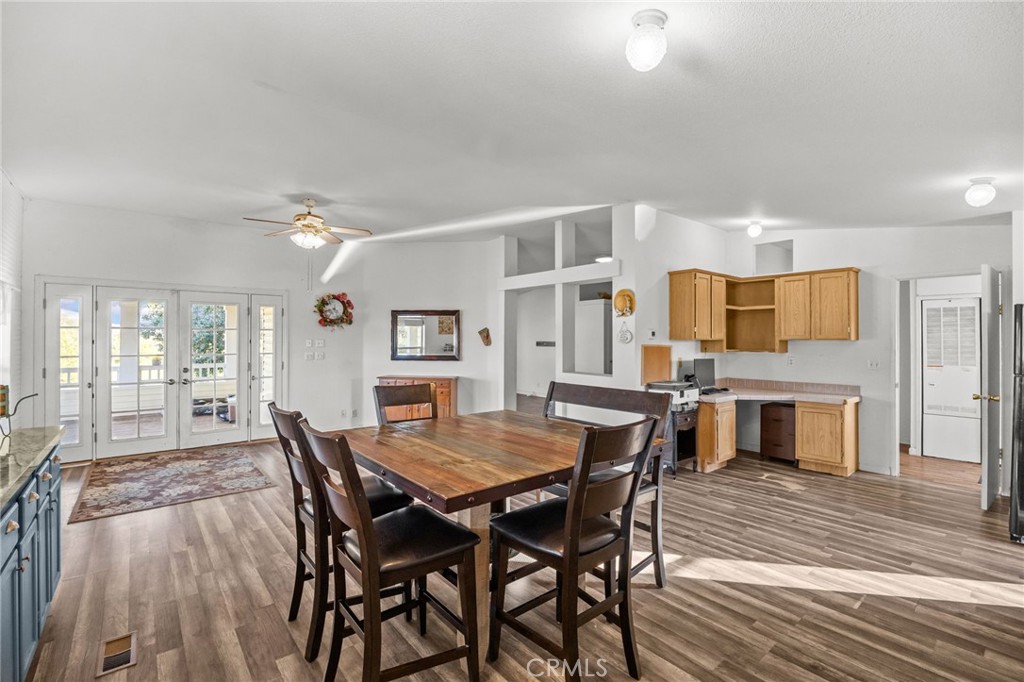 29825 Porth Road Murrieta, CA 92563 - Photo 17 of 40 a view of a dining room with furniture window and wooden floor